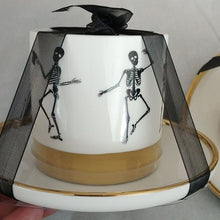 Load image into Gallery viewer, Halloween Elegance White+ Gold + Black Whimsical Skeletons Posing Coffee Tea Cups + Sauce…