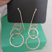 Load image into Gallery viewer, Silver tone Cascading Circle Dangle Earrings on French Hooks
