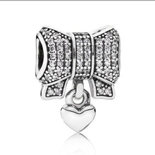 Load image into Gallery viewer, Pandora Retired Sterling Silver Heart and Bow Charm with Clear Zirconia - 791776