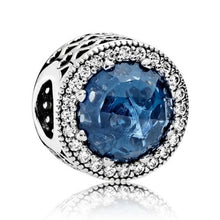 Load image into Gallery viewer, Pandora Sterling Silver Radiant Hearts Charm w/ Moonlight Blue Crystal 791725nmb