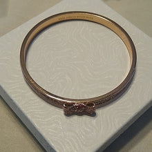 Load image into Gallery viewer, Kate Spade Take a Bow Enameled Bracelet in Rose Gold and Sparkling Pink