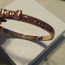 Load image into Gallery viewer, Kate Spade Take a Bow Enameled Bracelet in Rose Gold and Sparkling Pink