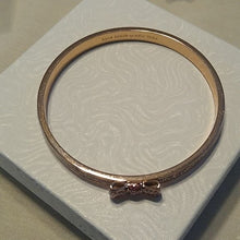 Load image into Gallery viewer, Kate Spade Take a Bow Enameled Bracelet in Rose Gold and Sparkling Pink