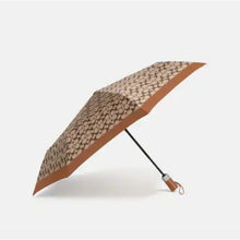 Load image into Gallery viewer, Coach F63364 Signature Retractable Umbrella, SV/Khaki/Saddle
