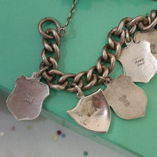 Load image into Gallery viewer, Vintage Silver Traveler&#39;s Bracelet with 15 Enamel Shield Charms
