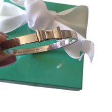 Load image into Gallery viewer, Kate Spade New York Take A Bow Bangle Bracelet, Silver, 2 3/8" opening
