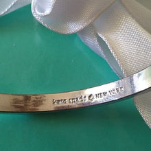 Load image into Gallery viewer, Kate Spade New York Take A Bow Bangle Bracelet, Silver, 2 3/8" opening
