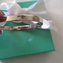 Load image into Gallery viewer, Kate Spade New York Take A Bow Bangle Bracelet, Silver, 2.5"
