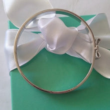 Load image into Gallery viewer, Kate Spade New York Take A Bow Bangle Bracelet, Silver, 2.5"
