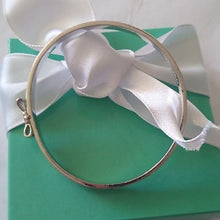 Load image into Gallery viewer, Kate Spade New York Take A Bow Bangle Bracelet, Silver, 2.5"
