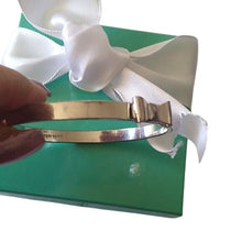 Load image into Gallery viewer, Kate Spade New York Take A Bow Bangle Bracelet, Silver, 2 3/8" opening
