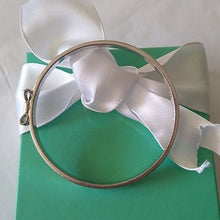 Load image into Gallery viewer, Kate Spade New York Take A Bow Bangle Bracelet, Silver, 2 3/8" opening
