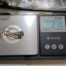 Load image into Gallery viewer, Sterling Silver Celtic Knot with Blue Topaz Dangle Earrings
