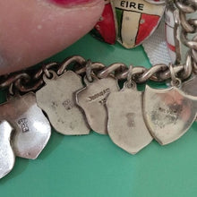 Load image into Gallery viewer, Vintage Silver Traveler&#39;s Bracelet with 15 Enamel Shield Charms
